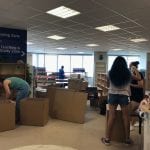 Packing up the library - note the old carpet
